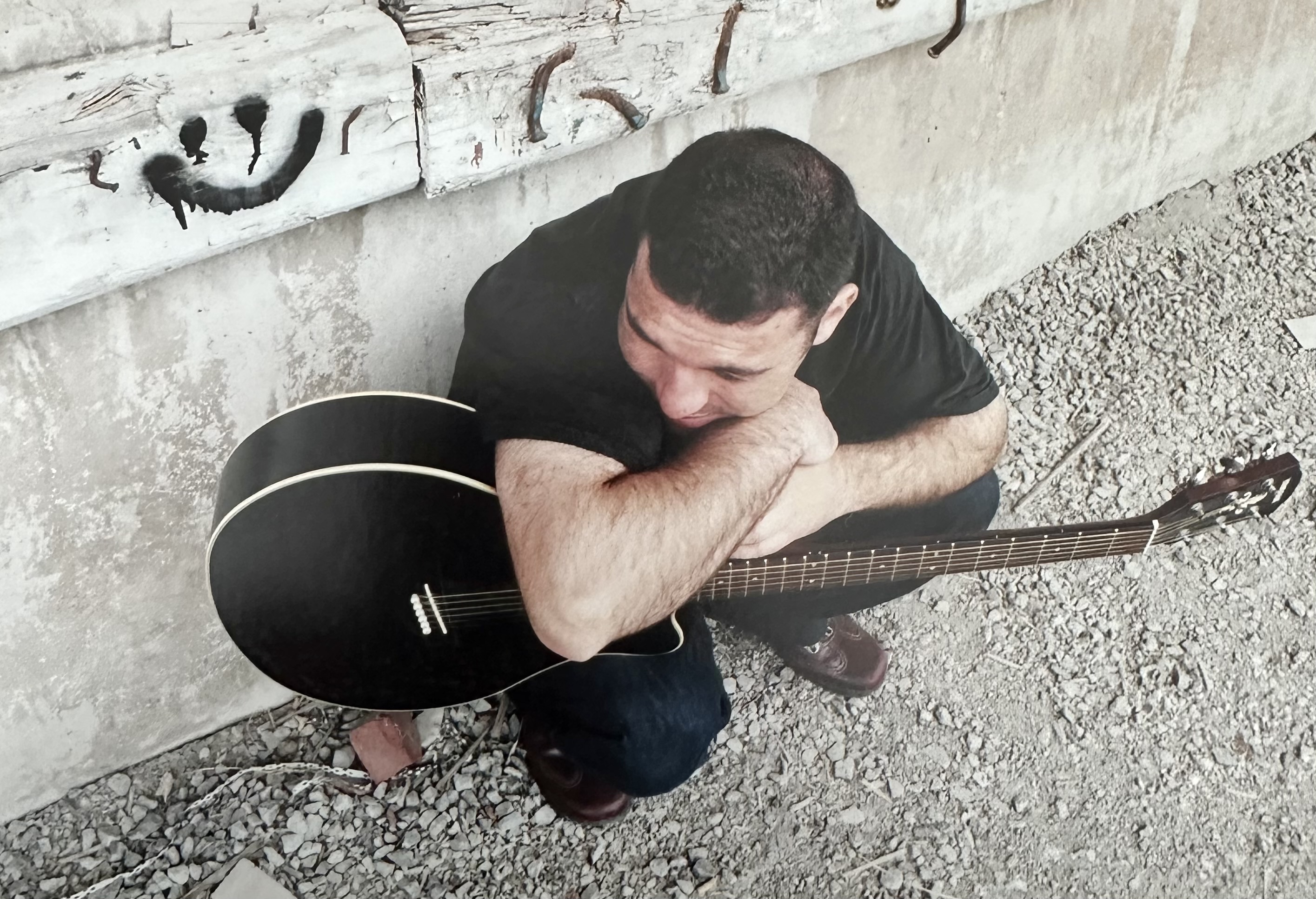 John with acoustic guitar